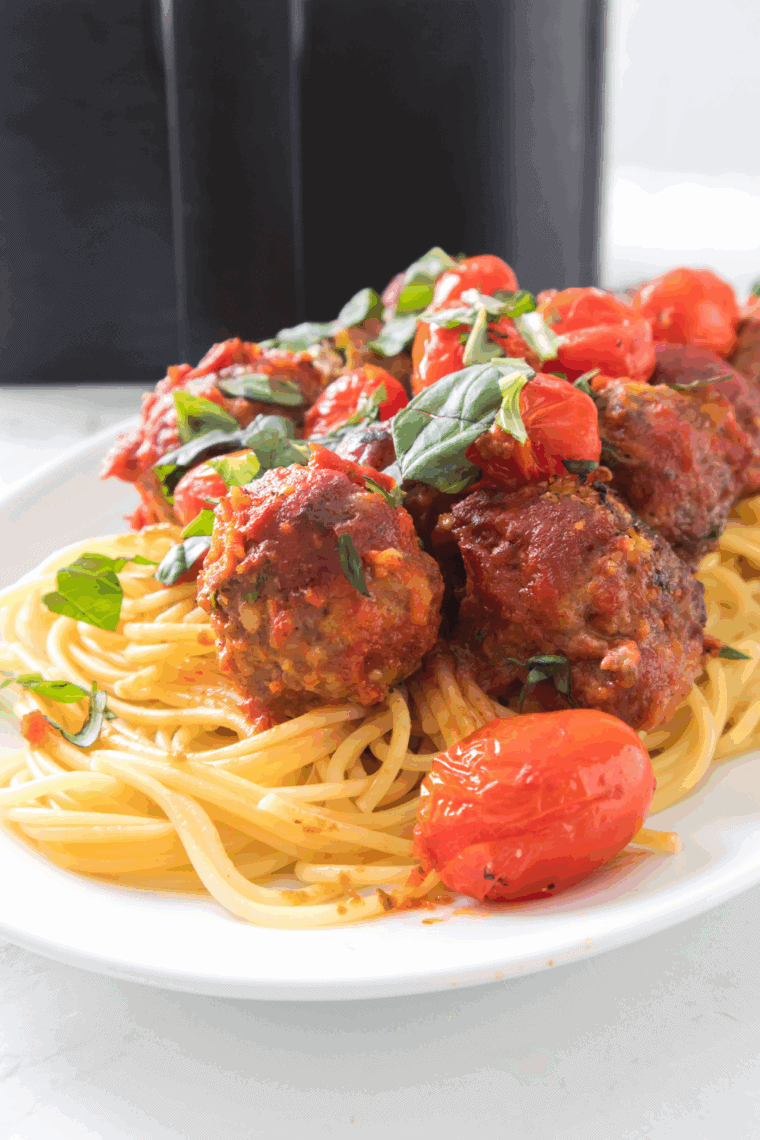 Air Fryer Spaghetti and Meatballs with crispy meatballs, perfectly cooked pasta, and marinara sauce, ready to serve for a delicious dinner.
