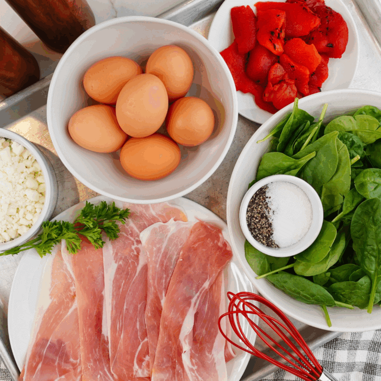 Ingredients needed for Air Fryer Spinach & Prosciutto Frittata Egg Muffins on kitchen table.