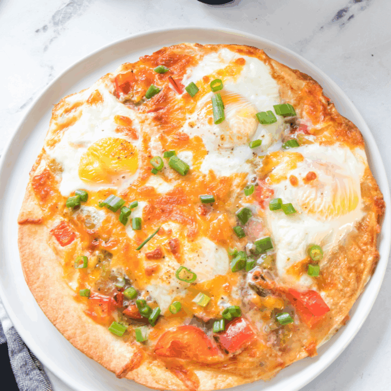 Air Fryer Tortilla Baked Eggs, with crispy tortillas and perfectly baked eggs, ready to enjoy for breakfast or brunch.