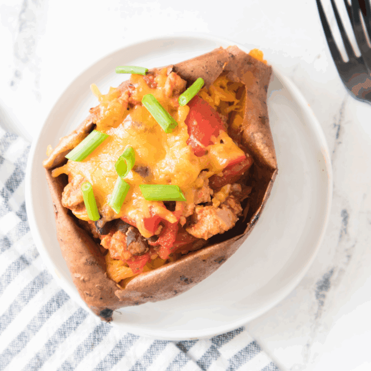 Air Fryer Turkey Chili Smothered Sweet Potatoes, featuring roasted sweet potatoes topped with flavorful turkey chili, perfect for a satisfying and healthy meal.