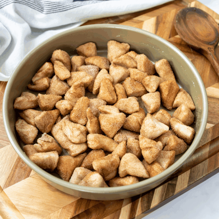Place coated biscuits into the baking pan.