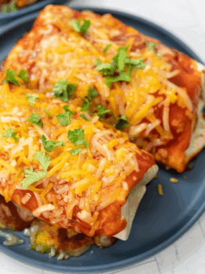 Blackstone Wet Burrito with seasoned beef, beans, cheese, and enchilada sauce, cooked to crispy perfection on the Blackstone griddle.