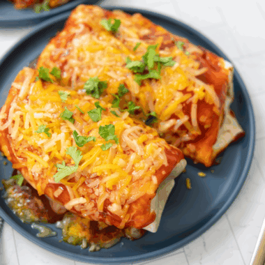 Blackstone Wet Burrito with seasoned beef, beans, cheese, and enchilada sauce, cooked to crispy perfection on the Blackstone griddle.