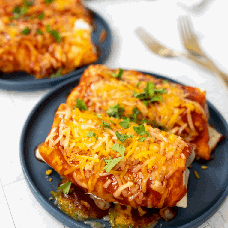 Blackstone Wet Burrito with seasoned beef, beans, cheese, and enchilada sauce, cooked to crispy perfection on the Blackstone griddle.