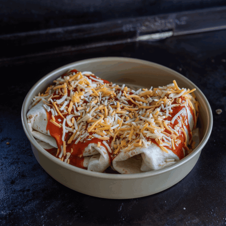 Blackstone Wet Burrito filled with seasoned beef, cheese, and enchilada sauce, cooked crispy on the Blackstone griddle.