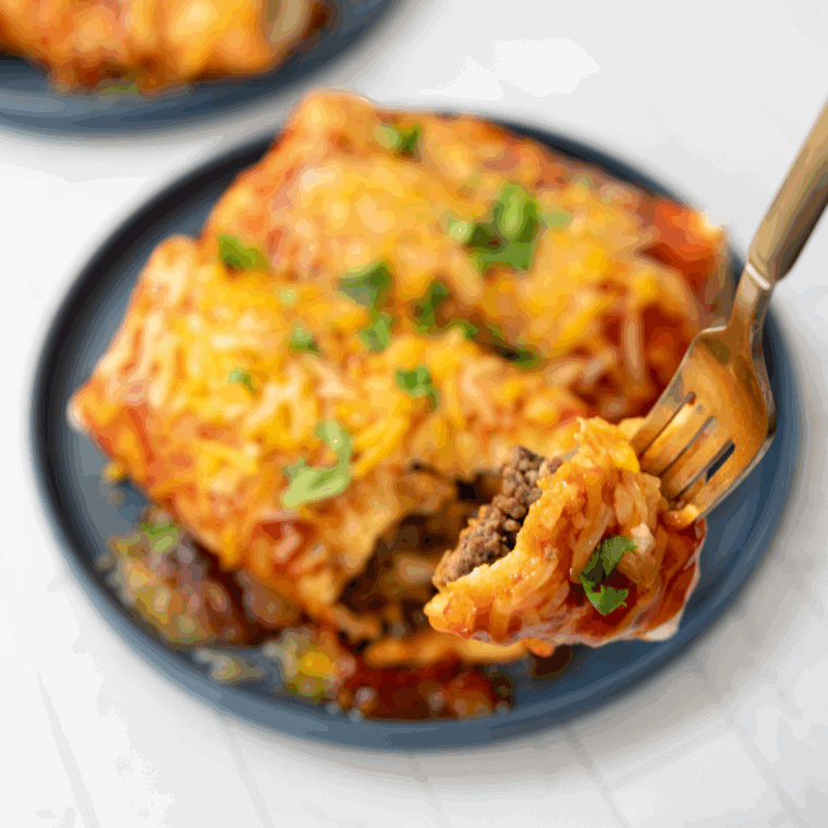 Blackstone Wet Burrito filled with seasoned beef, cheese, and enchilada sauce, grilled to crispy perfection on the Blackstone griddle.