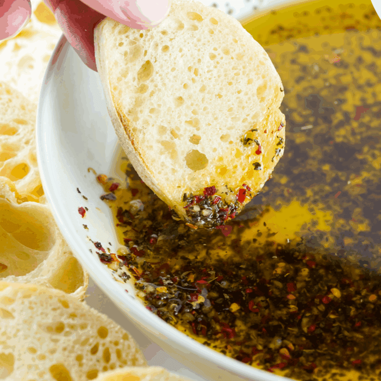 Plate of dipping oil and bread.