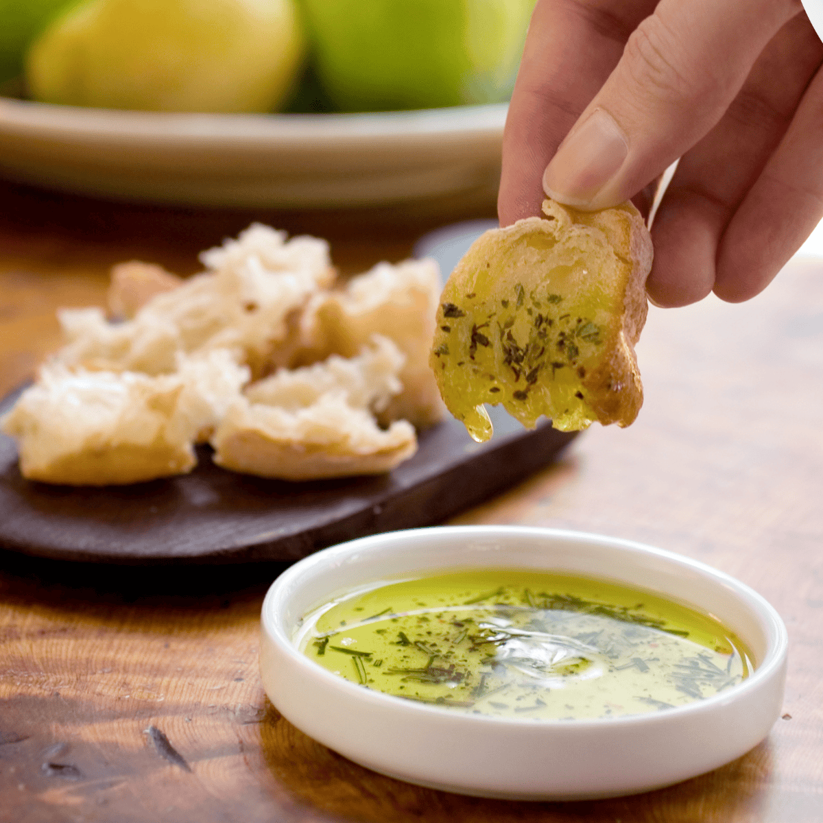 Bravo-style dipping oil made with olive oil, garlic, herbs, and spices, perfect for dipping fresh bread."