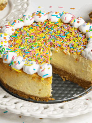 Cheesecake Factory Copycat Celebration Cheesecake featuring layers of creamy cheesecake, a graham cracker crust, and colorful fruit topping, perfect for special celebrations.