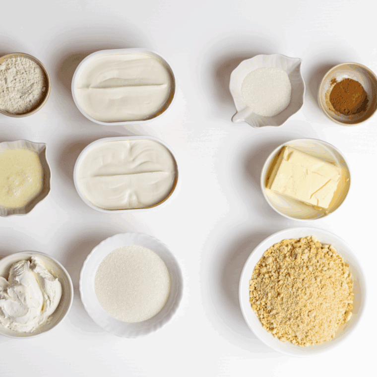 Ingredients needed for Cheesecake Factory Copycat Celebration Cheesecake on kitchen table.