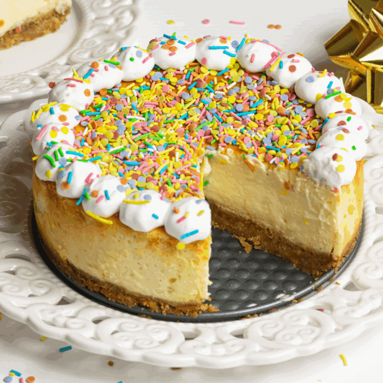 Cheesecake Factory Copycat Celebration Cheesecake featuring layers of creamy cheesecake, a graham cracker crust, and colorful fruit topping, perfect for special celebrations.