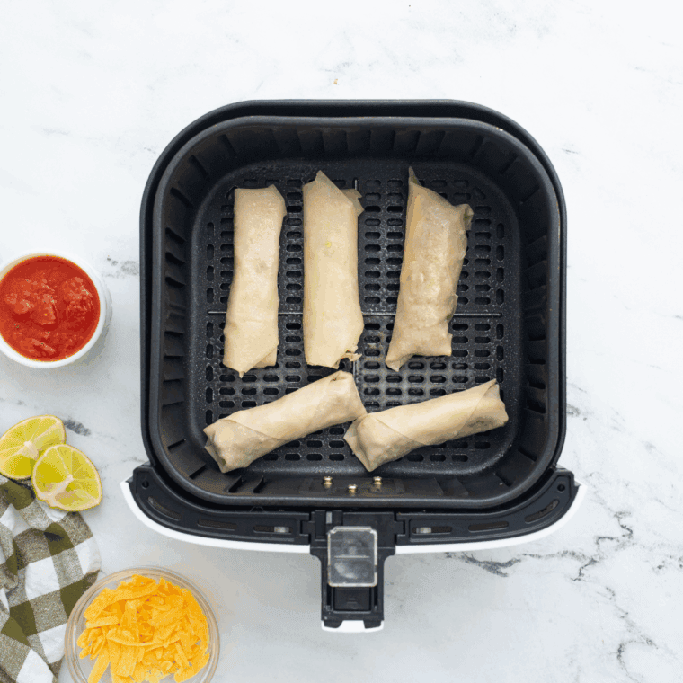 Place uncooked Jack in the Box Egg Rolls in the air fryer basket.