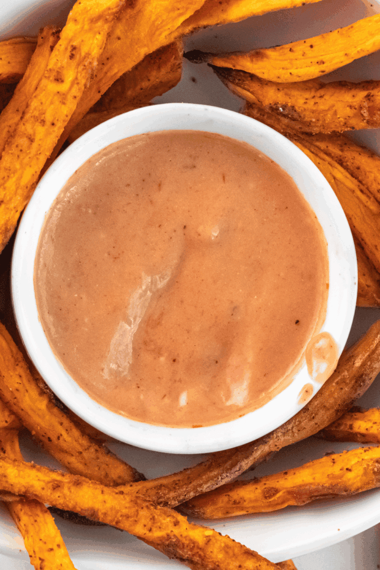 Creamy copycat Red Robin Campfire Sauce served in a small bowl with golden fries.