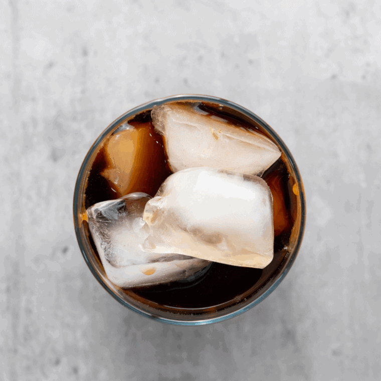 Pour the chilled coffee into the glass over the caramel syrup, then stir thoroughly to blend the flavors.