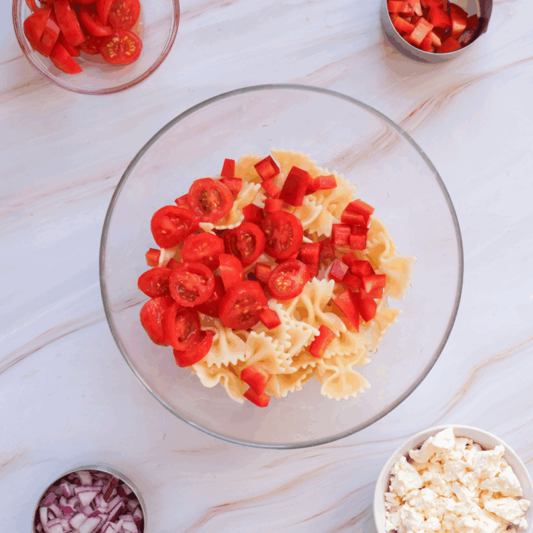 Placed diced vegetables into the bowl with the cooked pasta.