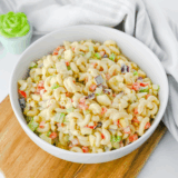 Gluten-Free Pasta Salad with fresh vegetables, topped with a flavorful dressing, ideal for picnics or a healthy meal.