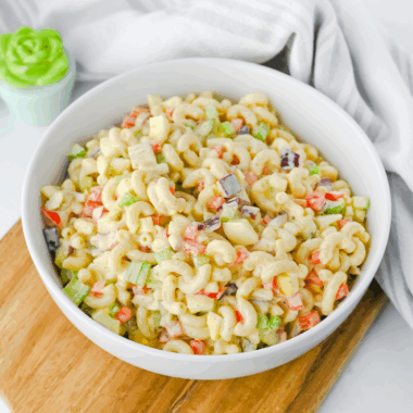 Gluten-Free Pasta Salad with fresh vegetables, topped with a flavorful dressing, ideal for picnics or a healthy meal.