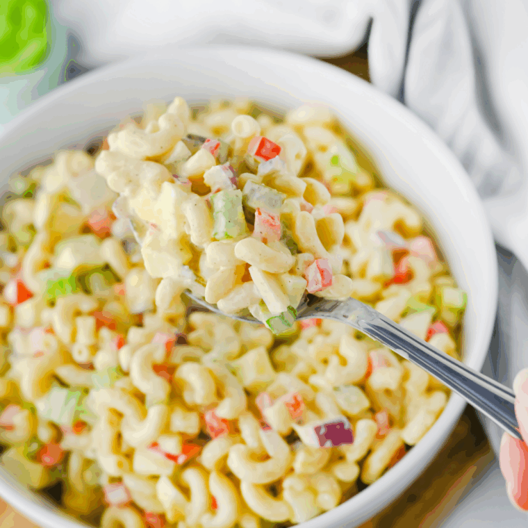 Gluten-Free Pasta Salad with vibrant vegetables, tossed in a tangy dressing, ideal for a light and refreshing meal.