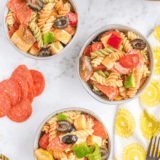Bowl of creamy Hooters-style pasta salad with rotini, veggies, and dressing.