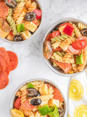 Bowl of creamy Hooters-style pasta salad with rotini, veggies, and dressing.
