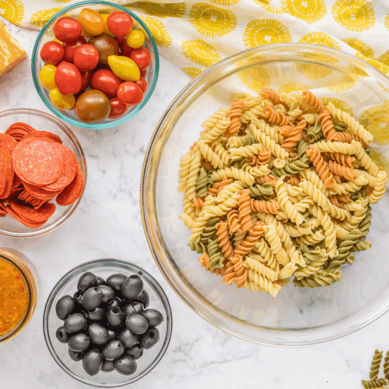 Ingredients needed for Hooters Pasta Salad Recipe on kitchen table.