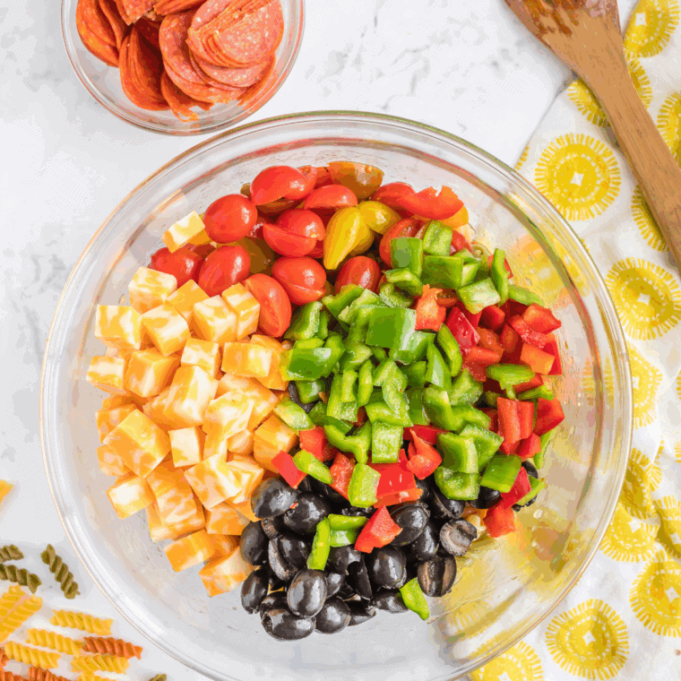 Toss the cooked pasta with freshly diced vegetables.