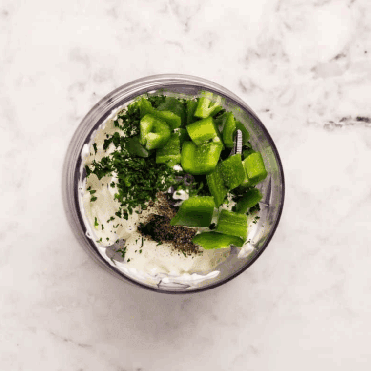 Fresh avocado, sour cream, lemon juice and spices, ready to mix.