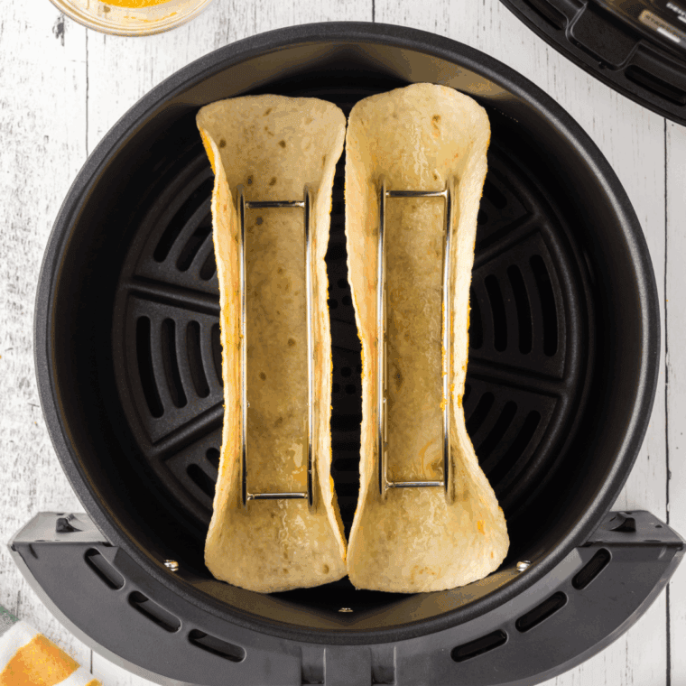Place the taco shells into the air fryer basket to soften.