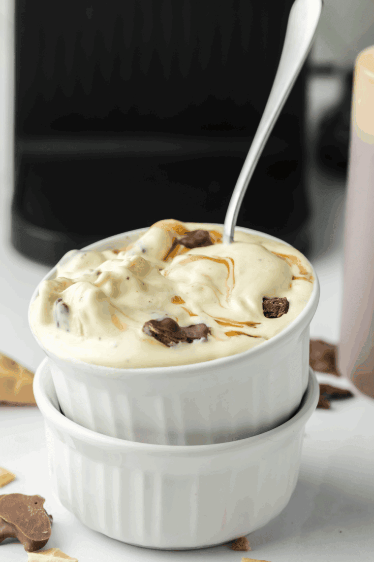 Creamy Ninja Creami Americone Dream ice cream with fudge ribbons and chocolate-covered waffle cone chunks.