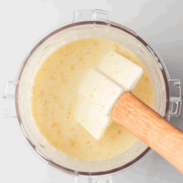 Whisking vanilla pudding mix, milk, and heavy cream together in a mixing bowl until smooth.