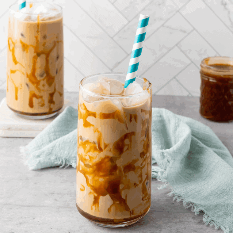 Rich and creamy Ninja Creami Copycat Starbucks Mocha Frappuccino, served in a tall glass with whipped cream on top.