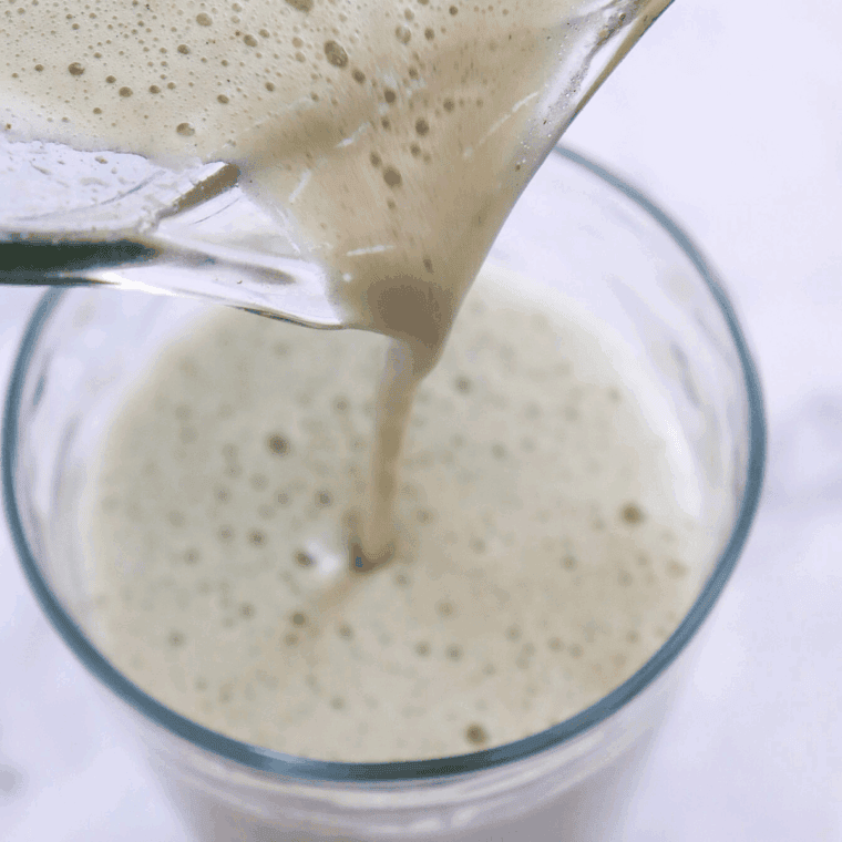 Whisking matcha powder and sugar with warm water, then pouring into a Ninja Creami Pint Container to freeze for 24 hours.
