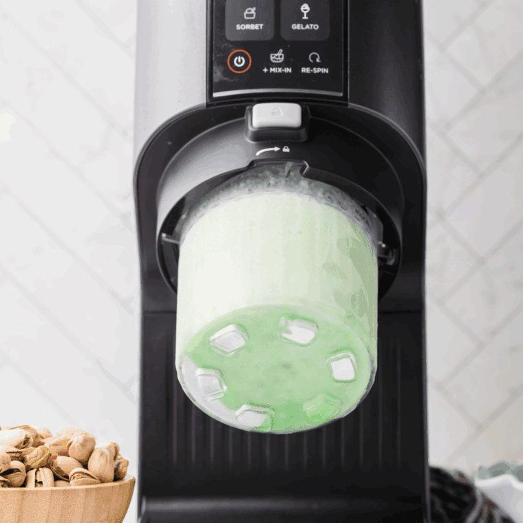 Removing the Deluxe Pint from the freezer, placing it into the outer bowl, and securing the lid assembly before selecting the CREAMICCINO setting.