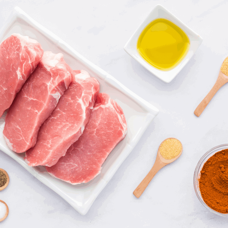 Ingredients needed for Ninja Foodi Grill Pork Chops on kitchen table.