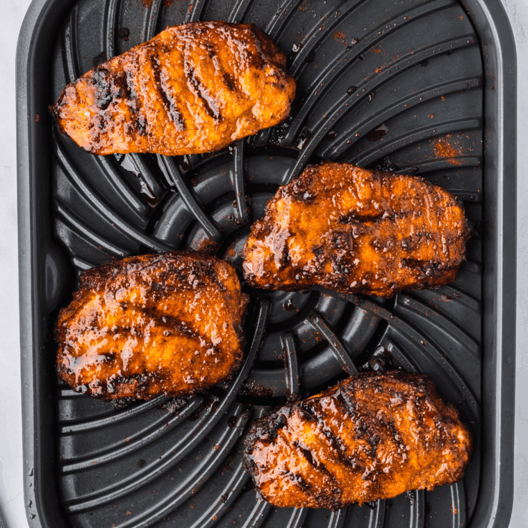 Cooked Ninja Foodi Grill Pork Chops on the grill plate.