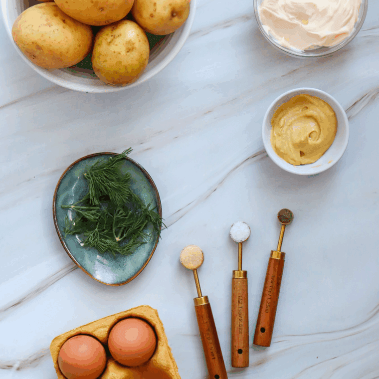 Ingredients needed for Red, White and Blue Potato Salad on kitchen table.