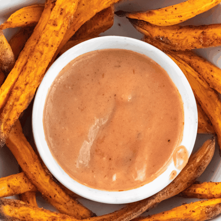 Homemade copycat Red Robin Campfire Sauce in a bowl with fries for dipping.