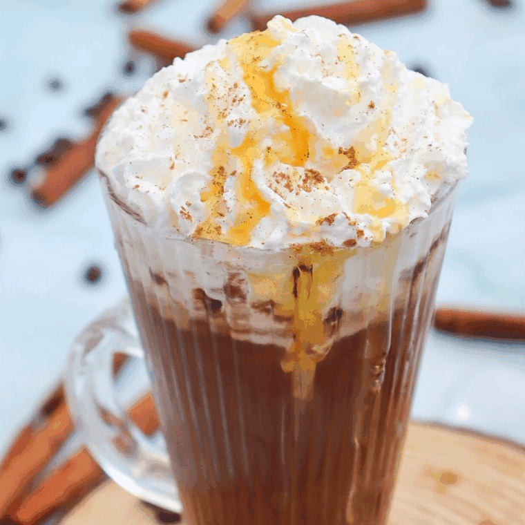 Homemade Starbucks Cinnamon Dolce Latte with espresso, cinnamon syrup, steamed milk, and whipped cream, topped with a sprinkle of cinnamon.