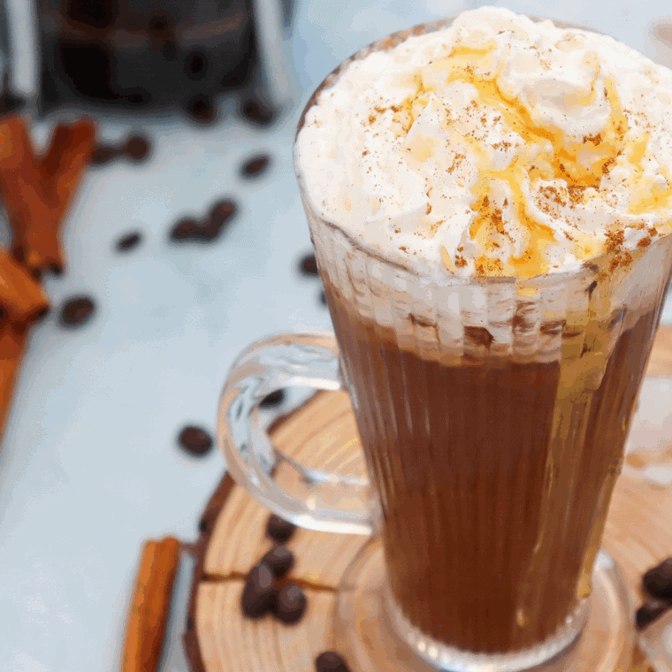 Glass of Starbucks Cinnamon Dolce Latte Recipe on kitchen table.