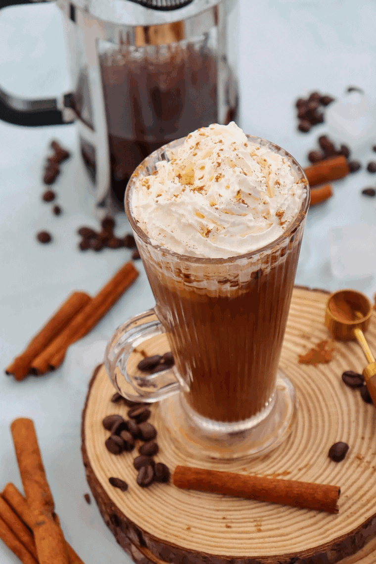 Homemade Starbucks Cinnamon Dolce Latte made with espresso, cinnamon syrup, steamed milk, whipped cream, and cinnamon garnish.