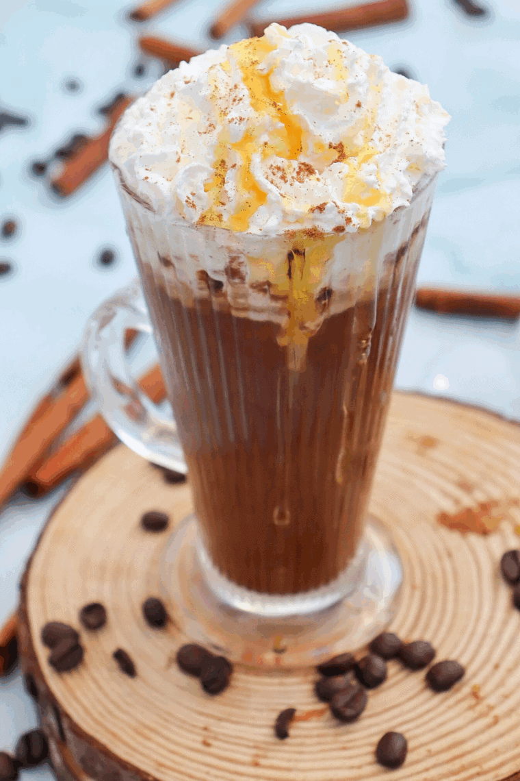 Homemade Starbucks Cinnamon Dolce Latte with espresso, cinnamon syrup, steamed milk, whipped cream, and a sprinkle of cinnamon.