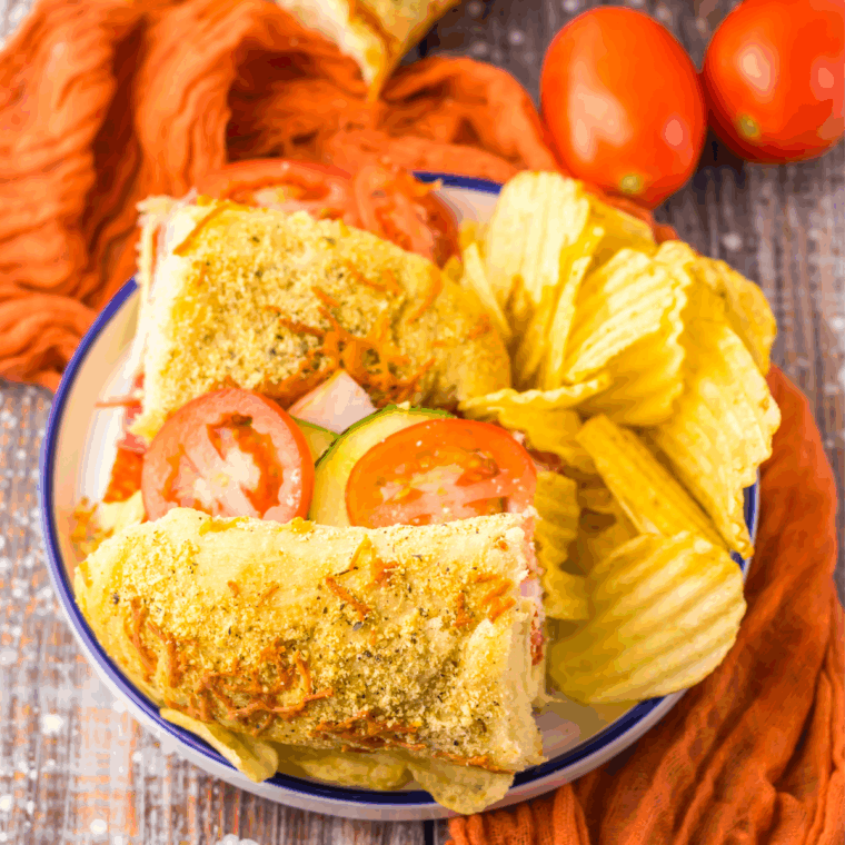Freshly baked homemade Subway Italian Herb and Cheese Bread, golden brown with melted cheese and a sprinkle of Italian herbs.