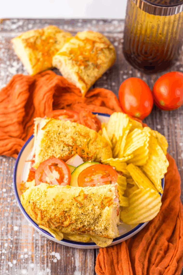 Freshly baked Subway Italian Herb and Cheese Bread, golden brown with a cheesy, herb-coated crust.