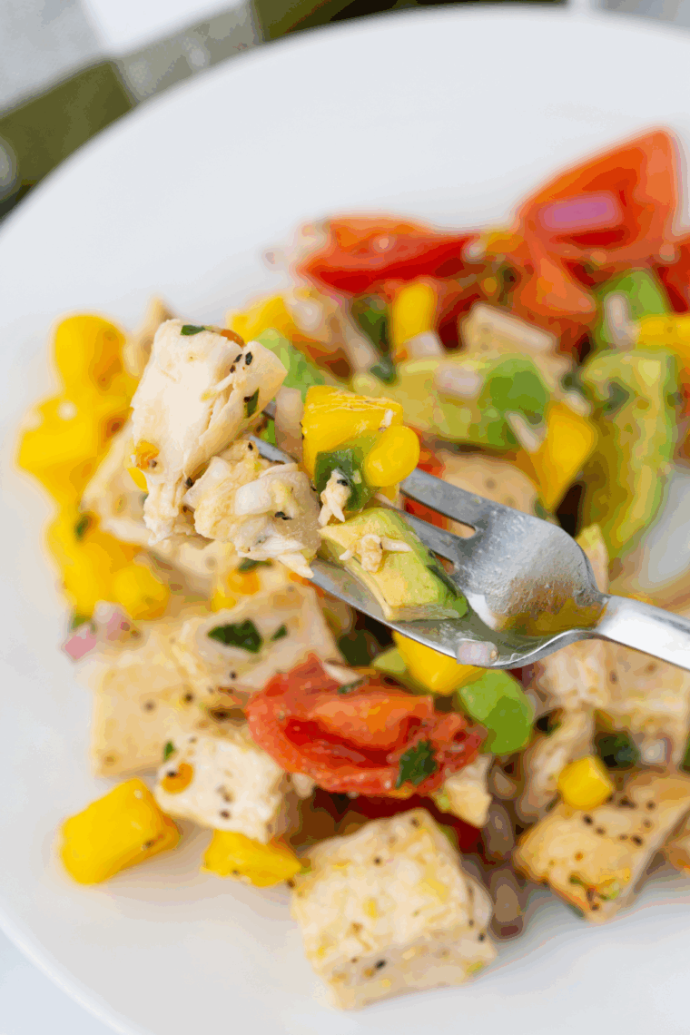 Fresh Air Fryer Avocado Chicken Mango Salad with grilled chicken, ripe mango chunks, avocado slices, and mixed greens in a bowl.