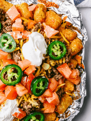 Plate of Air Fryer Beef Totchos with ground beef, melted cheese, and toppings