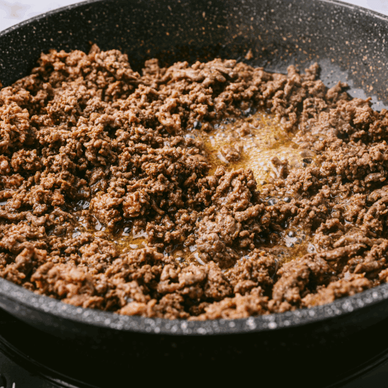 Cook the ground beef in the cast iron skillet.