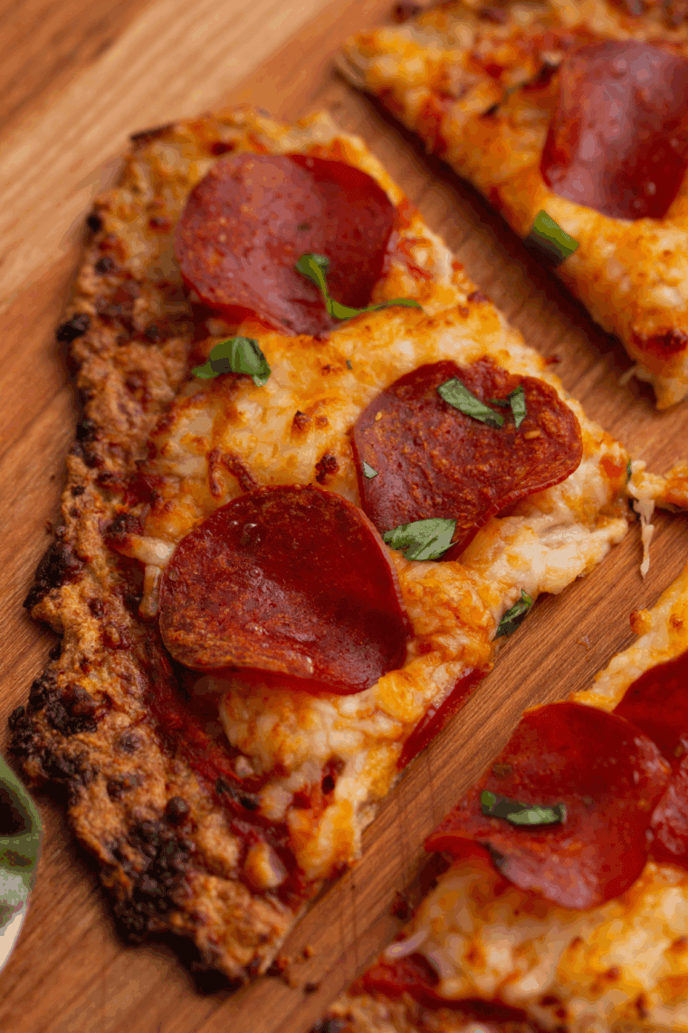 Air Fryer Chicken Crust Pizza with melted cheese and fresh toppings on a crispy chicken base.