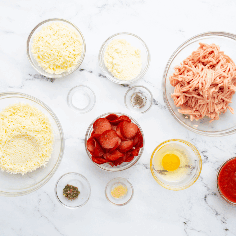 Ingredients needed for Air Fryer Chicken Crust Pizza on kitchen table.