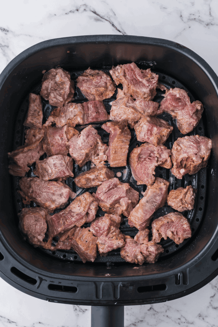 Place coated beef into the air fryer basket.