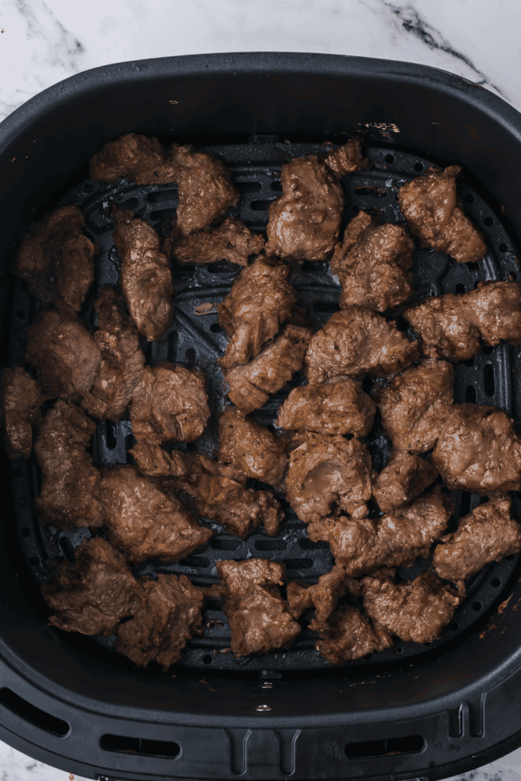 Cooked Copycat Panda Express Beijing Beef in the air fryer basket.